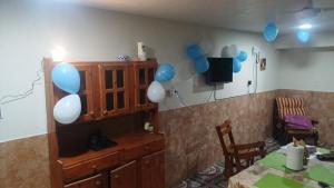 a room with blue and white balloons on the wall at Casa Del Pino in La Banda