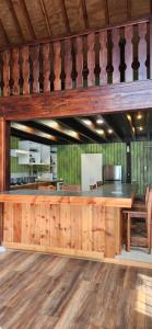 a kitchen with a wooden counter in a room at casa caburgua en cerro in Caburgua