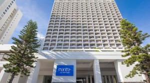 a large white building with a sign in front of it at Oceans 11 in Gold Coast +19 photos