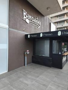 a building with a sign on the side of it at Departamento para Dos in Temuco
