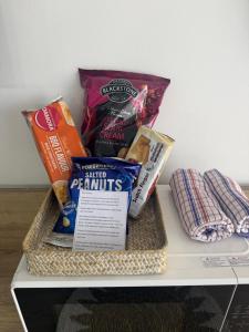 a basket of food and snacks on a shelf at Oceans 11 in Gold Coast