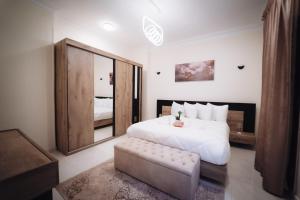 a bedroom with a large bed and a large mirror at Star Luka Private Hotel Room 2 in Luxor +7 photos