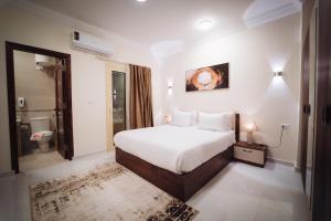 a hotel room with a bed and a bathroom at Star Luka Private Hotel Room 2 in Luxor