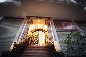 an entrance to a building with stairs and a sign at Star Luka Private Hotel Room 2 in Luxor