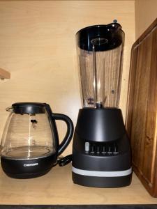 a black blender sitting on top of a counter at Sweet Escape Cozy Studio in Fort Lauderdale