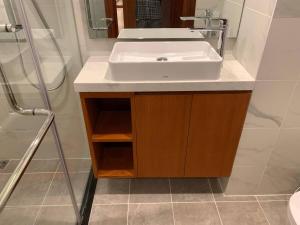 a bathroom with a sink and a shower at Modern Condo in Phnom Penh ByDN in Phnom Penh +21 photos