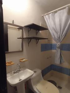 a bathroom with a sink and a toilet and a tub at Casa Constructor staff colaboradores in Cabo San Lucas