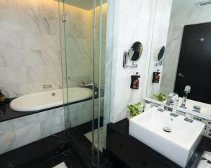 a bathroom with a tub and a sink and a shower at Perdana Kota Bharu in Kota Bharu +56 photos