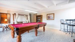 a room with a red pool table in it at Ruthmor Villas in Toowoomba