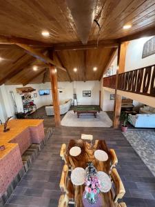 a large living room with a table in the middle at Cabaña con Piscina para Descansar in Chihuahua