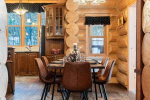 a dining room with a table and chairs at Fiddler Lake Resort - Bear 14 in Mille-Isles