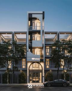 a building with a car parked in front of it at SP house in Ho Chi Minh City