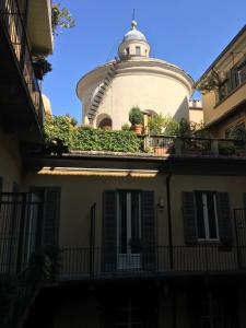 a building with a dome on top of it at Le Petit Hotel in Turin