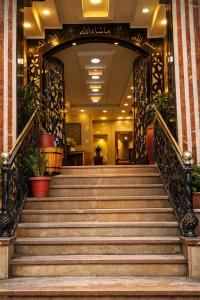 a staircase leading to a hotel lobby at star Luka Luxury in Jazīrat al ‘Awwāmīyah