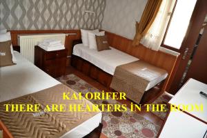 Кровать или кровати в номере Aspawa Hotel