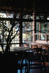a table and chairs with wine glasses on it at RoheN HAKONEYUMOTO in Hakone