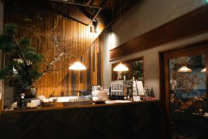a counter in a restaurant with lights on it at RoheN HAKONEYUMOTO in Hakone