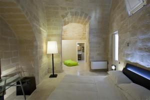 Postel nebo postele na pokoji v ubytování Antico Convicino Rooms Suites & SPA