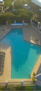 an overhead view of a large pool of blue water at Apartment 231 in Gnarabup