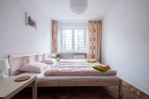 Posteľ alebo postele v izbe v ubytovaní Center Warsaw - Apartament Jana Pawła