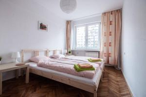 Posteľ alebo postele v izbe v ubytovaní Center Warsaw - Apartament Jana Pawła