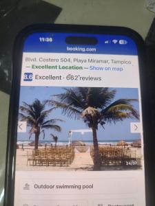 a cell phone screenshot of a wedding on the beach at Arenas del mar in Monterrey