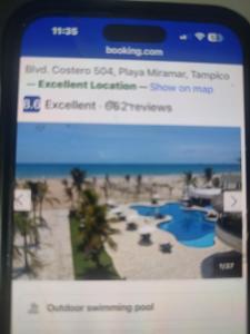 a page of a website with a picture of a beach at Arenas del mar in Monterrey