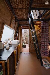 a room with a staircase in a house at mango house, hide out Can Tho in Ấp Bình Thương