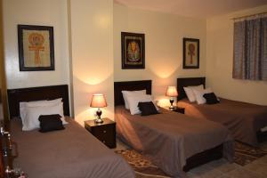 Letto o letti in una camera di Pyramids Overlook Inn