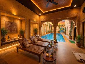 a living room with a swimming pool in a house at Hotel Tokyo Palace in Jaisalmer