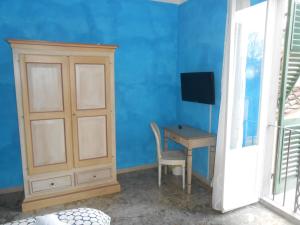 Televízia a/alebo spoločenská miestnosť v ubytovaní Scala Apartment