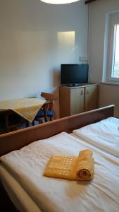 Postel nebo postele na pokoji v ubytování Pension Sonnengrund