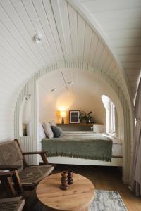 a bedroom with a large bed in an archway at Iglupark in Tallinn