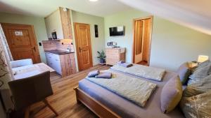a living room with two beds and a couch at A&Z Apartment Siegl in Bad Aussee
