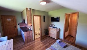 a room with a sink and a dresser in a room at A&Z Apartment Siegl in Bad Aussee