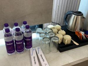 a group of bottles of water sitting on a counter at Hotel Crown in Dwarka