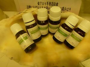 a group of five bottles of honey on a table at Taketomijima Akaneya in Taketomi