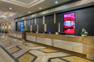 a lobby of a hotel with a reception desk at Susesi Luxury Resort in Belek +168 photos