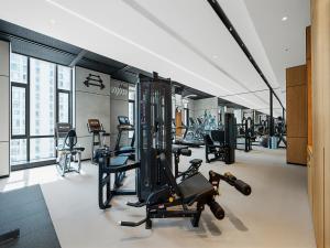 a gym with treadmills and exercise equipment in a building at Four Points by Sheraton Qingtian in Qingtian