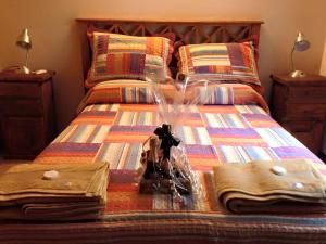 a bed with a bunch of items on it at Puerto Escondido in Santa Teresita