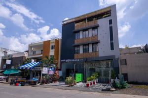 a building on the side of a street at Hotel Pravasa Stay, Dewas Naka in Indore
