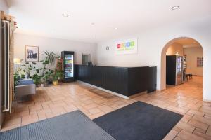 a lobby of a store with a reception desk at Happy Hotel Berlin in Berlin