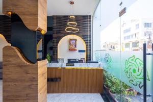 a restaurant with a counter in a building at Hotel Pravasa Stay, Dewas Naka in Indore