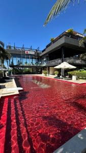 a large red fountain in front of a building at Rosso Sky Villa Phu Quoc in Phú Quốc