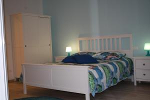 Łóżko lub łóżka w pokoju w obiekcie La casa di Kro