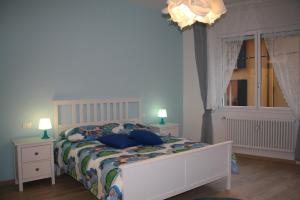 Łóżko lub łóżka w pokoju w obiekcie La casa di Kro