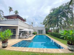 a swimming pool in the backyard of a villa at Residence Villa 3 Bedroom in Bang Tao Beach