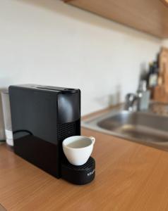 a microwave sitting on a counter with a bowl in it at Mirca by the Sea in Mirce