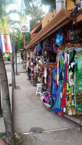 a store filled with lots of colorful umbrellas at Hotel La Palapa in Tamarindo