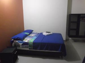 Hotel Monarca Putumayo客房内的一张或多张床位
